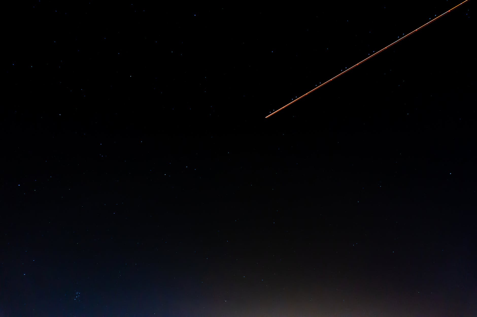 photo of shooting star during night time